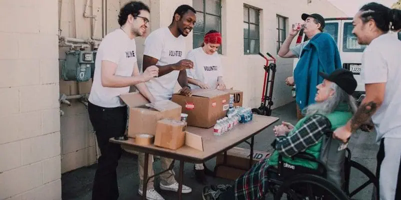 a group of people volunteering in a charity event