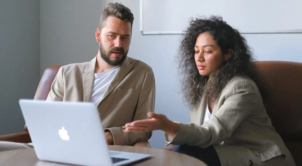 two employees discussing at work