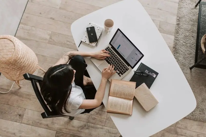a woman working in a laptop