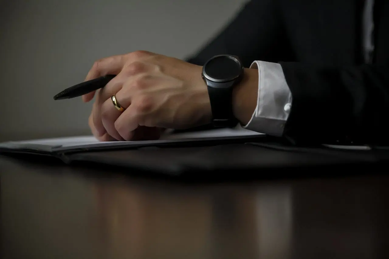 a lawyer with hands on a document