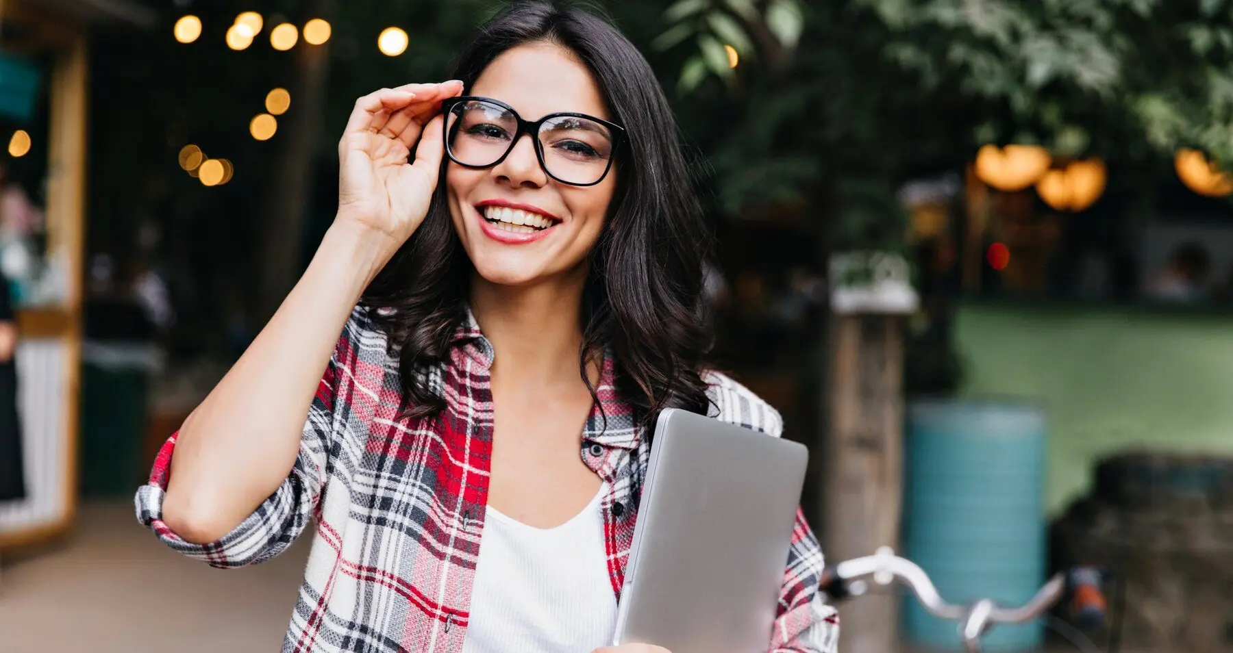 a student holding a laptop