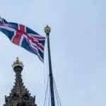 UK flag flying over the Houses of Parliament