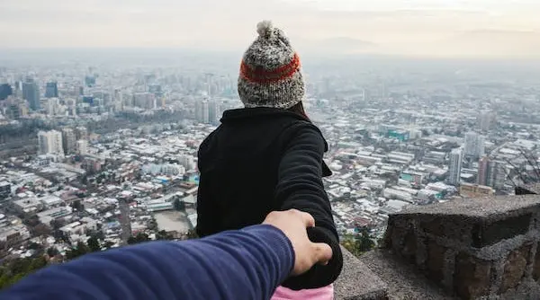 a woman holding hand with her partner