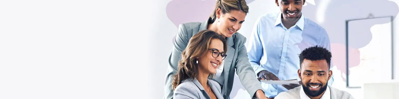 Four people gathered around computer