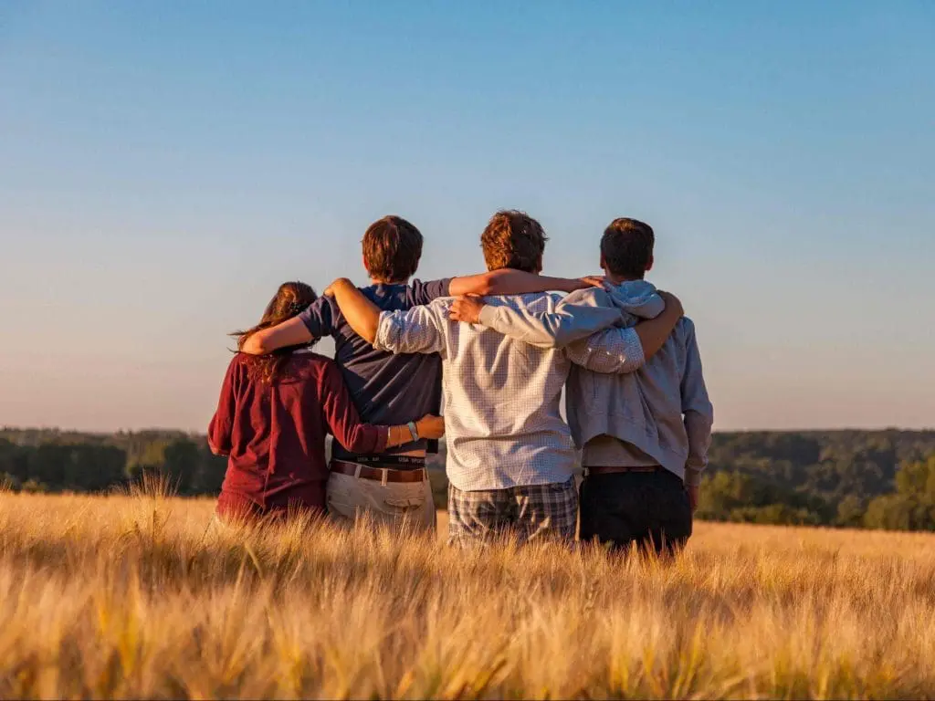 family of people sitting on grass