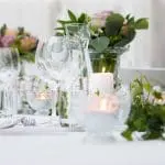 flowers on a table to signify a wedding reception
