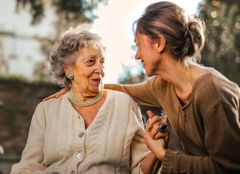 Young adult with elderly woman