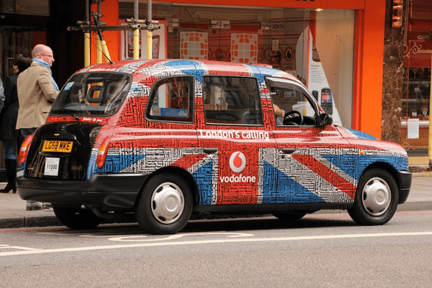 Black taxi cab with Union Jack Flag printed on side