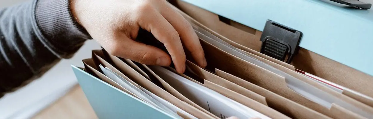 Person choosing document in folder