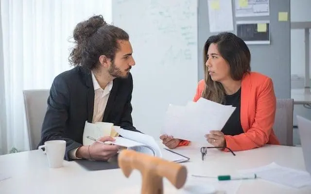 man and women with documents