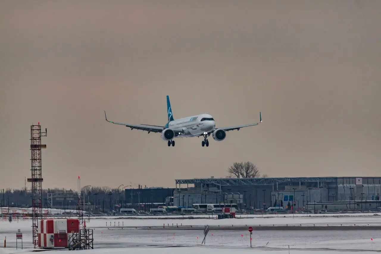 plane touching down at airport