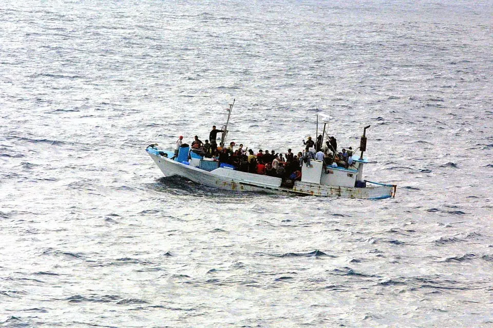 people on a boat in the middle of the sea
