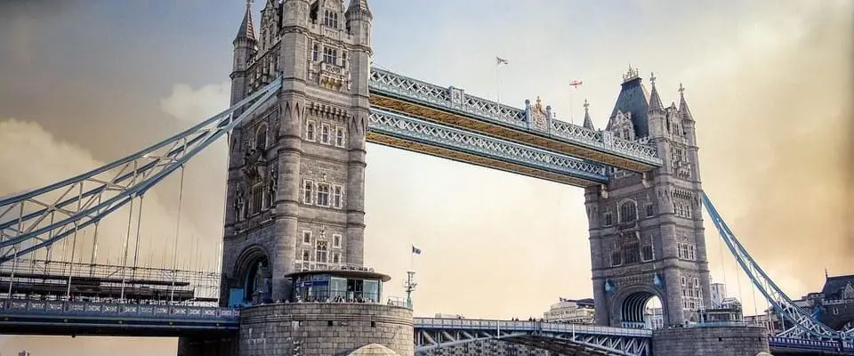 brown suspension bridge over brown river