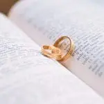 wedding rings on top of a book