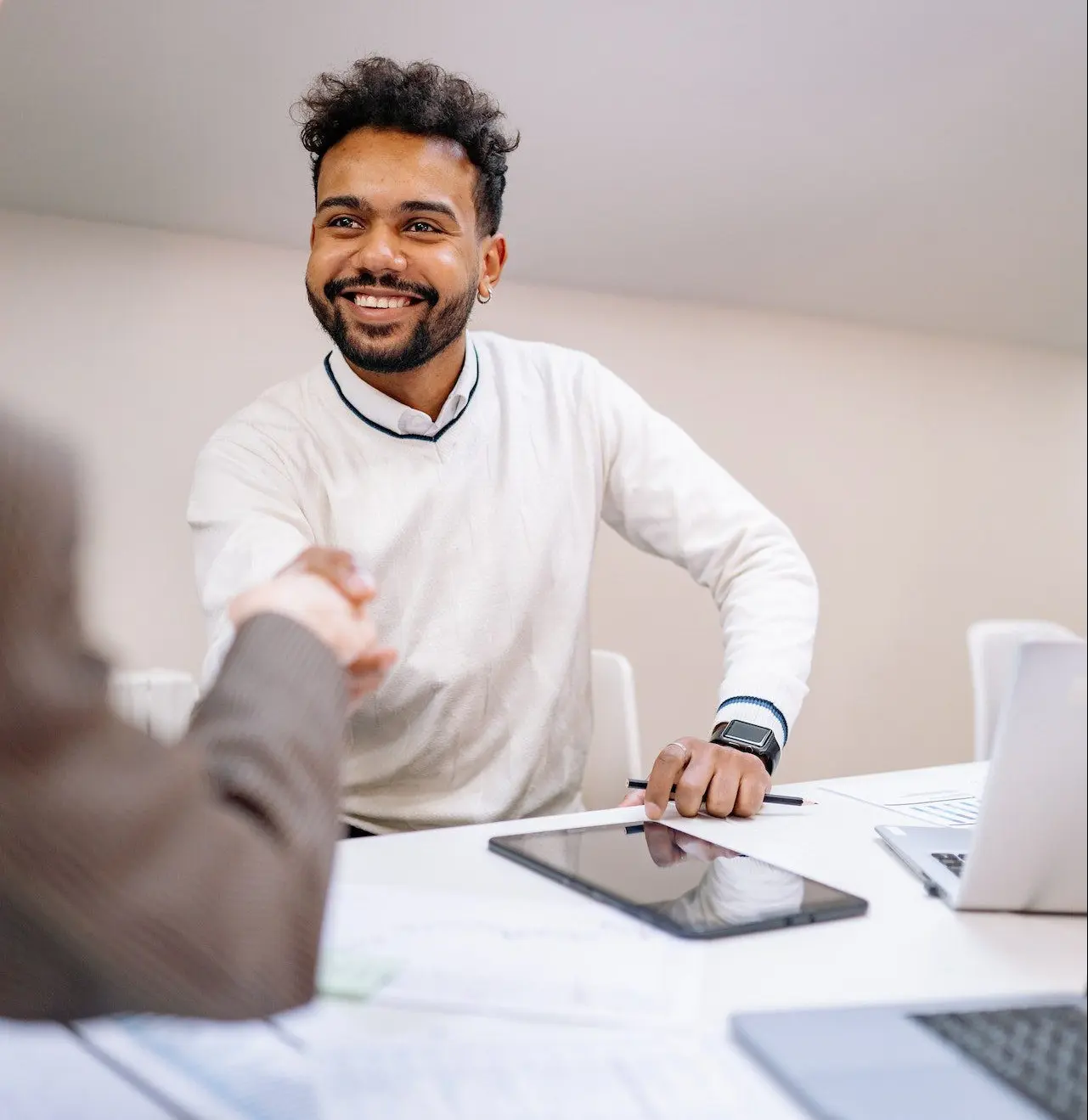 a person smiling to represent a positive grievance outcome