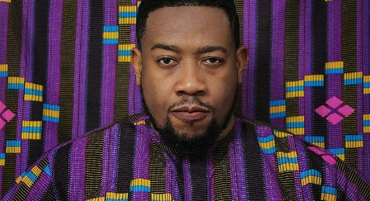 Nigerian man wearing purple coloured shirt