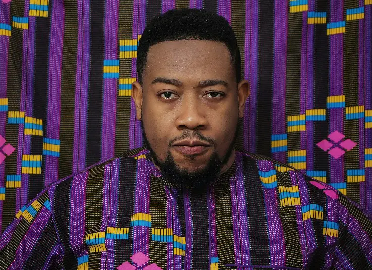 Nigerian man wearing purple coloured shirt