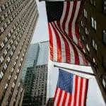 US flags handing down in a US city street