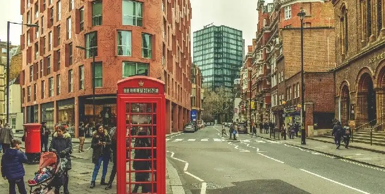 People on London street, by red telephone booth