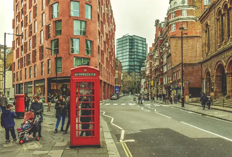 People on London street, by red telephone booth