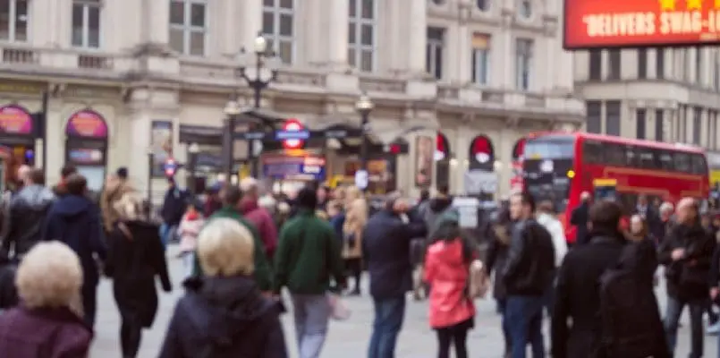 People waiting for bus in busy London street