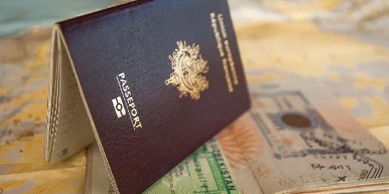 Passports and a visa page open