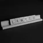 Lawyer letters in wooden scrabble pieces