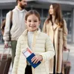 Family of three with luggage and passport