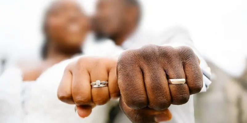 Close-up of newly weds wedding bands