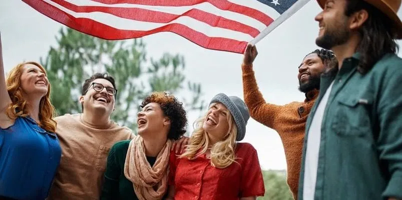 a group of people under an American flag