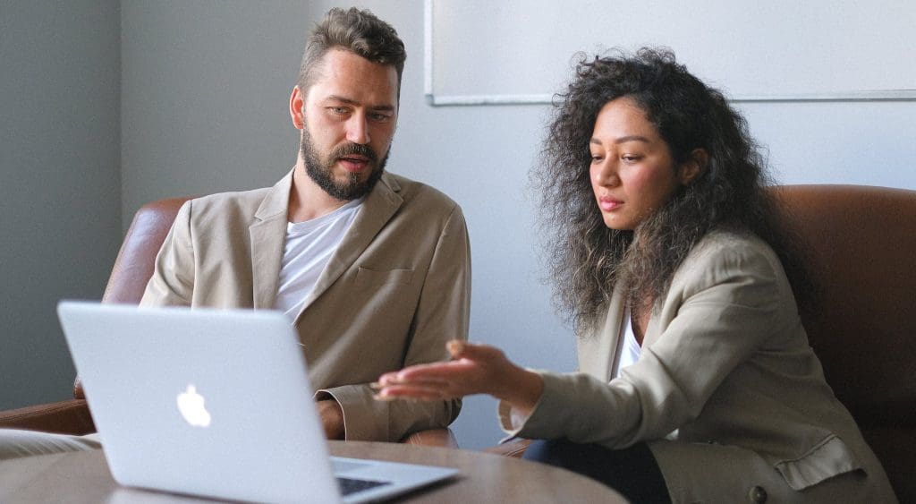 two employees discussing at work