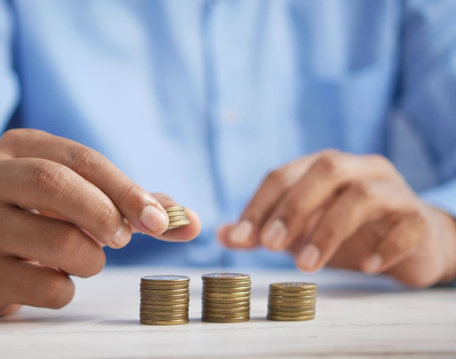 a man stacking coins