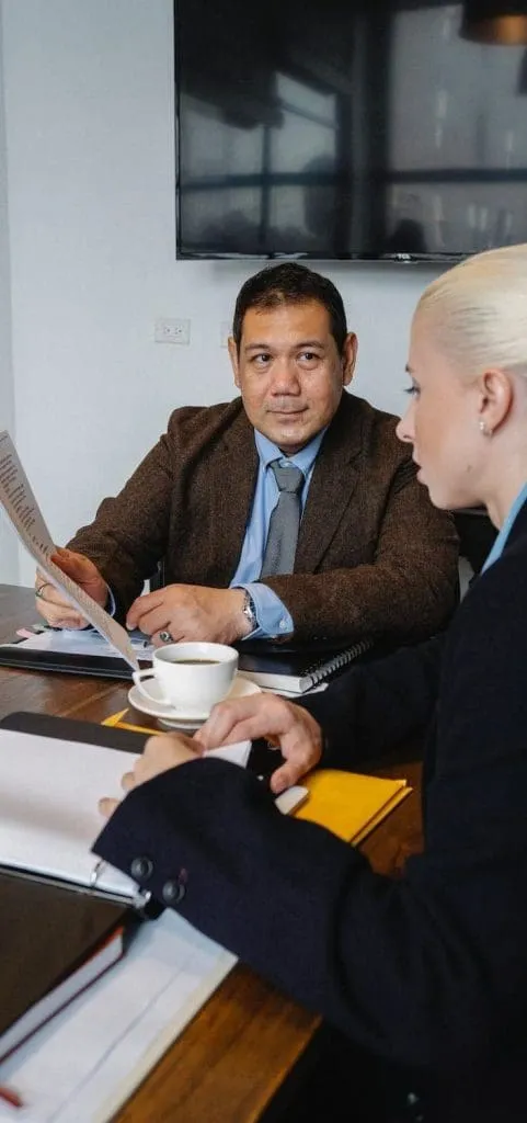 an employer and an employee in a meeting