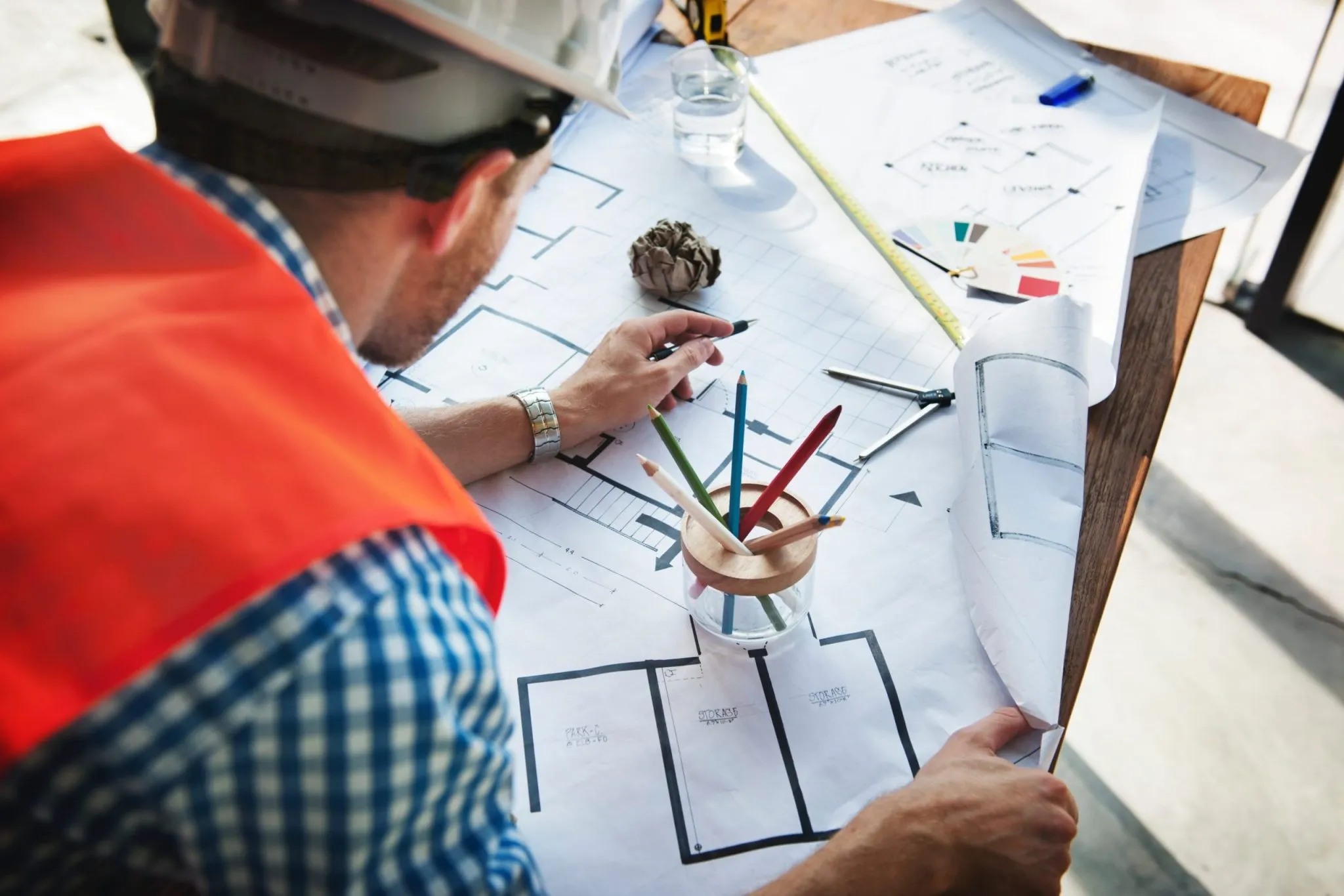 Construction worker looking at building plans