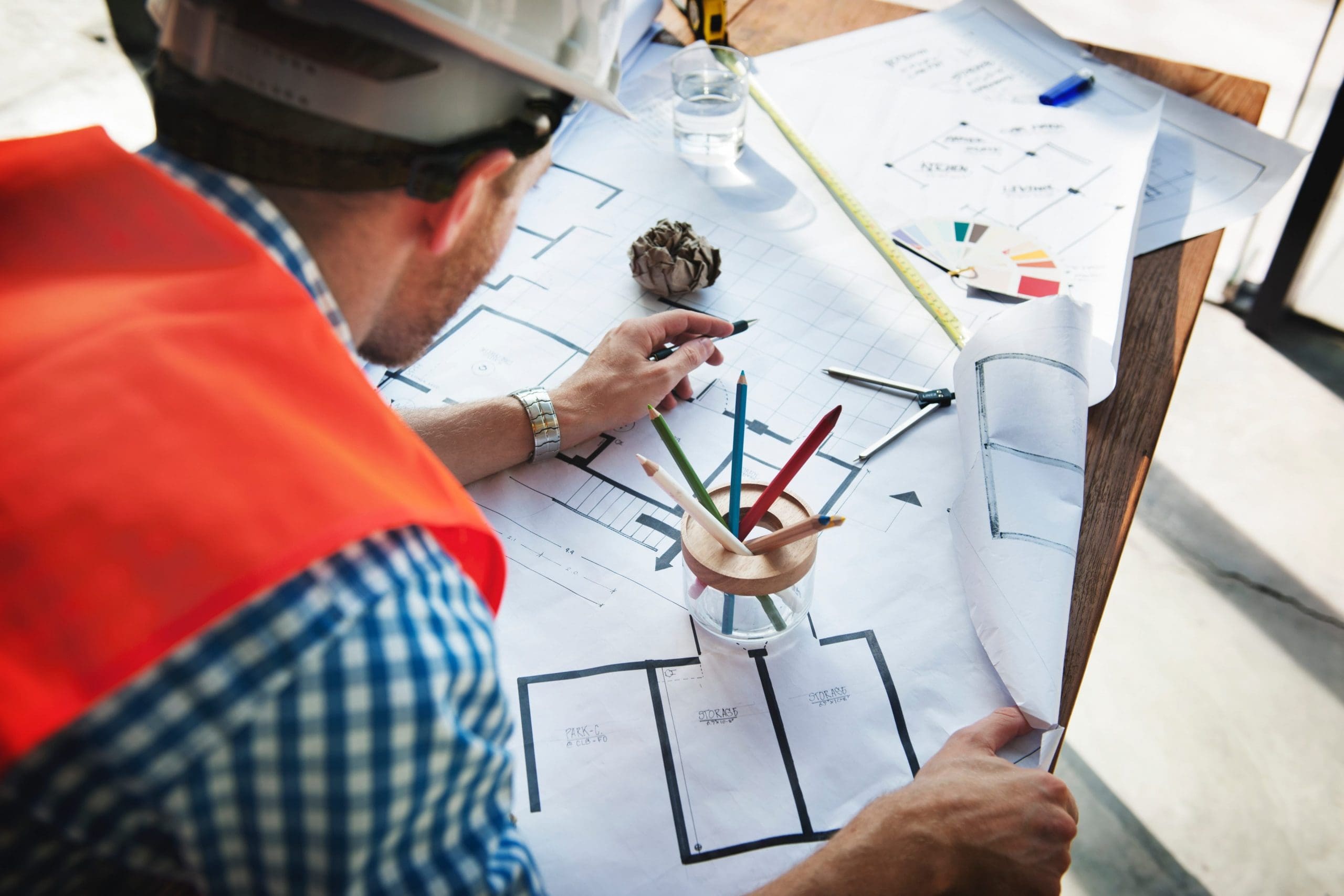 Construction worker looking at building plans