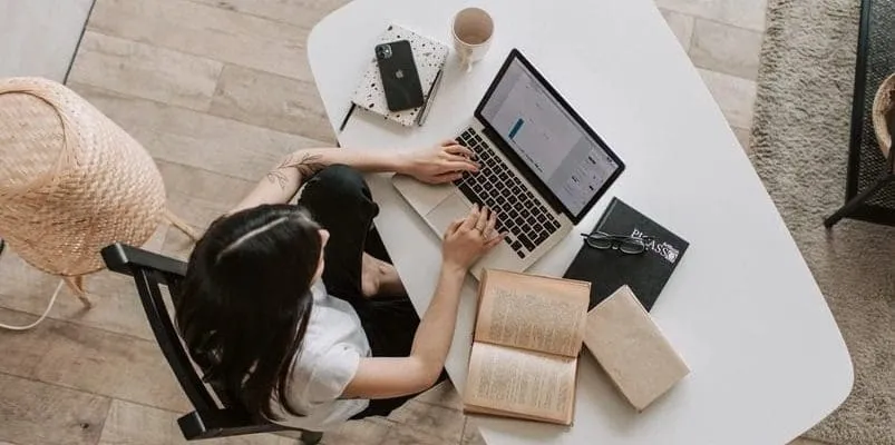 a woman working in a laptop