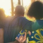 a Nigerian family hugging each other