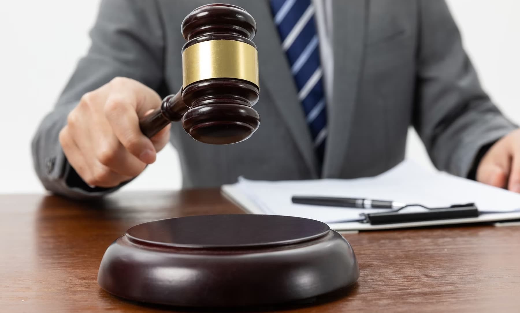 a person holding a gavel