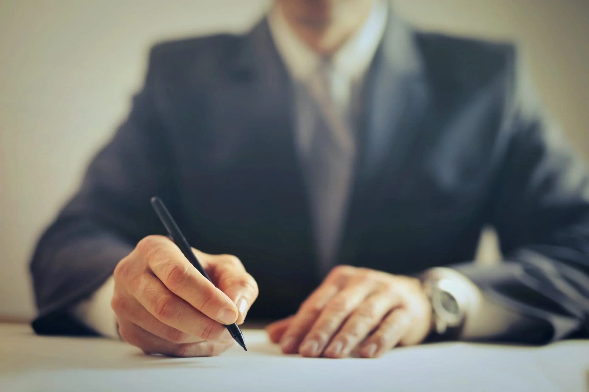 an employee writing in a paper
