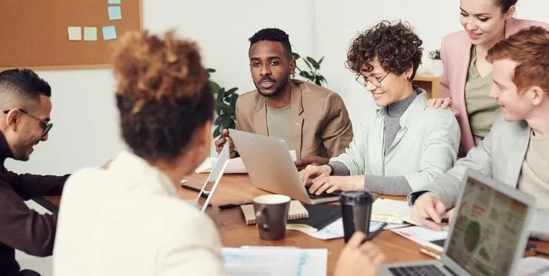 a group of employees in a meeting