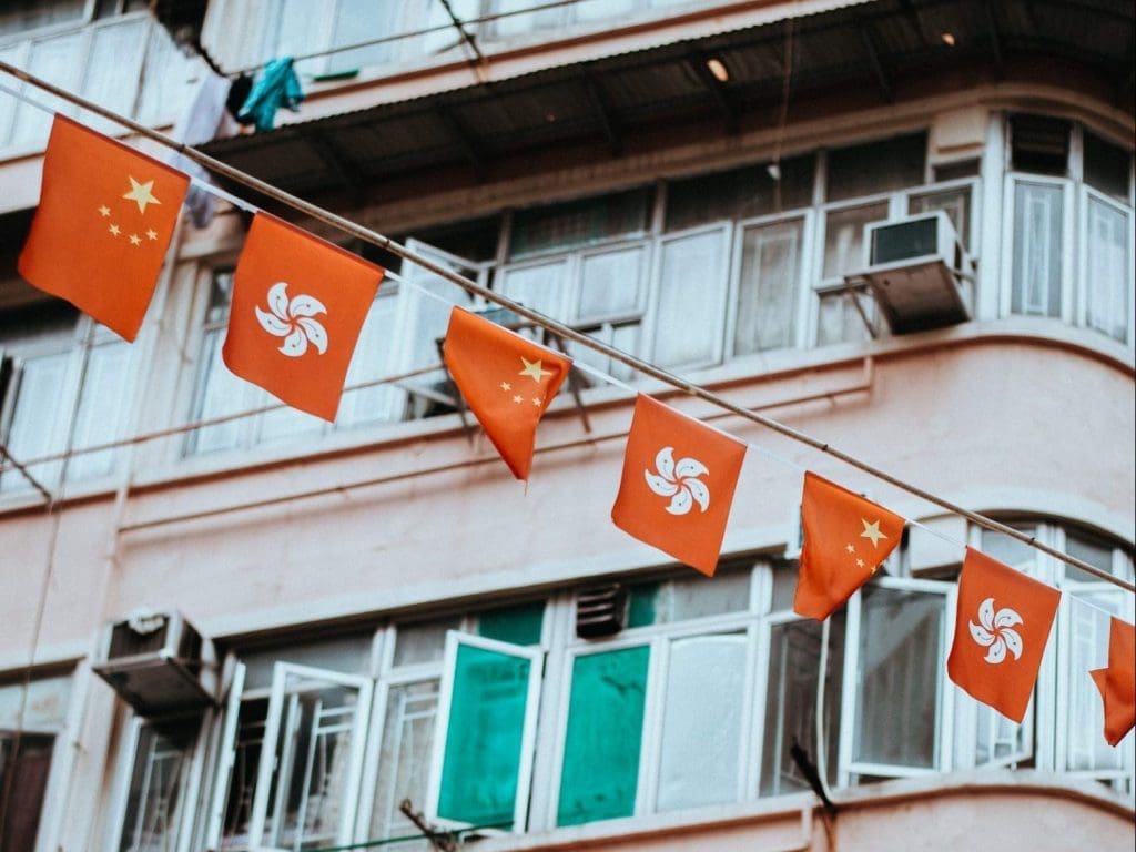 small red flags flying on a line