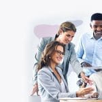 Four people gathered around computer