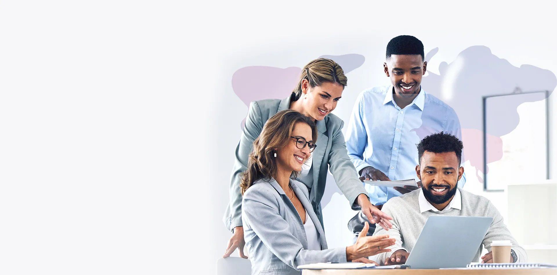 Four people gathered around computer