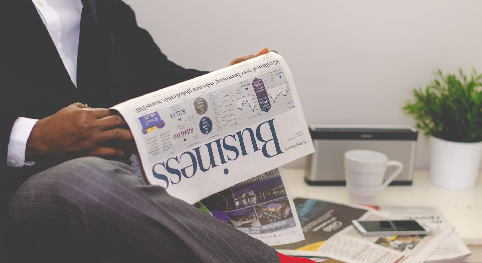 Man reading business newspaper