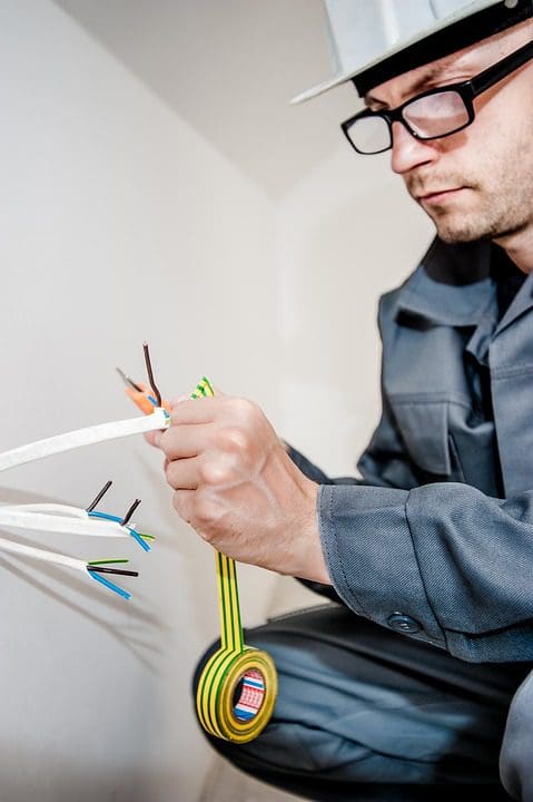 Workman carrying out electrical work