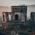 old grey concrete building on a hill