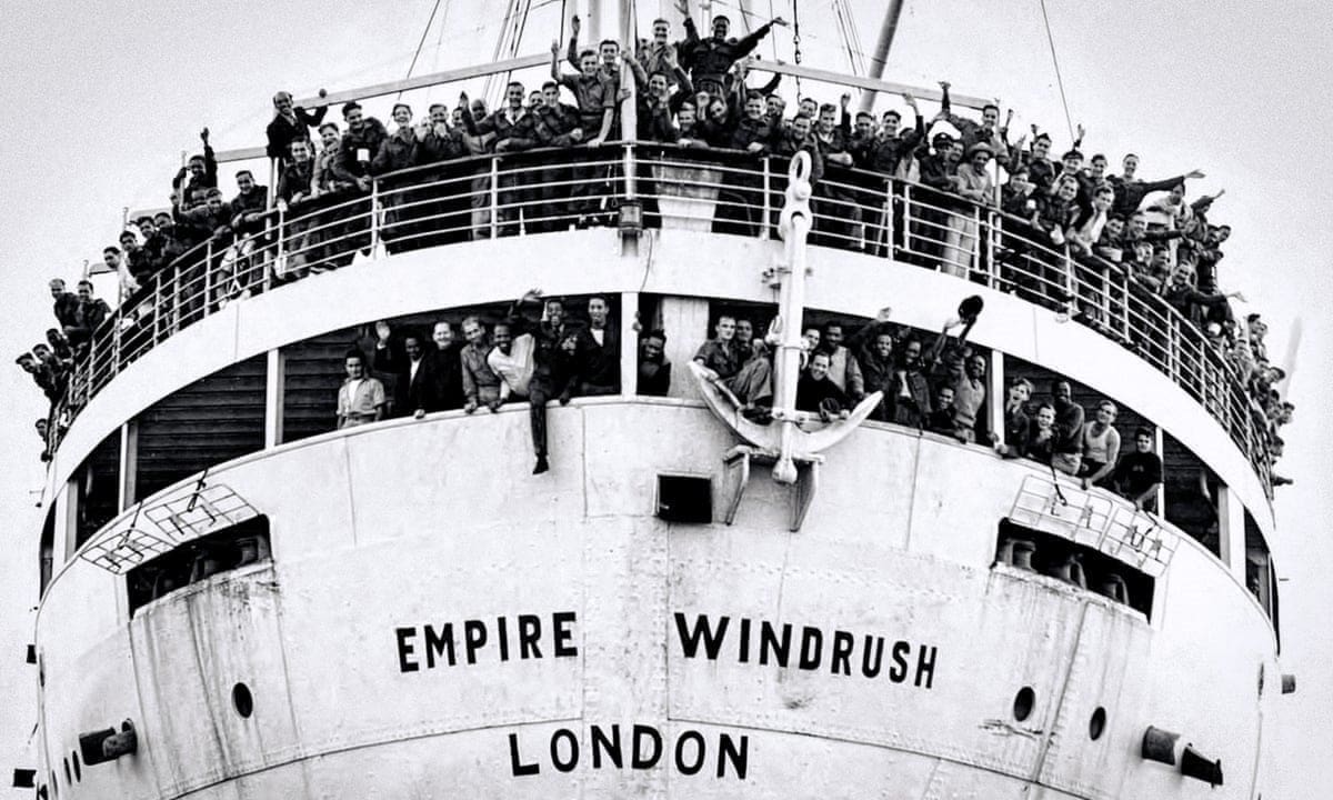 black and white photo of windrush ship with passengers visible
