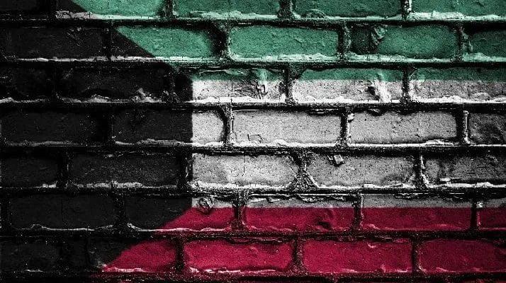 Kuwait flag on brick wall