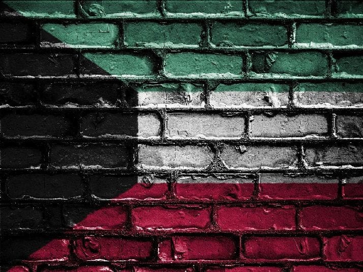 Kuwait flag on brick wall