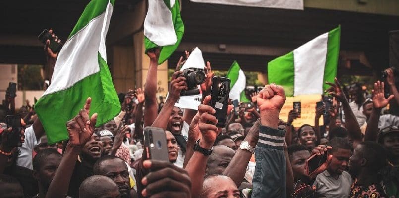 People waving Nigerian flags